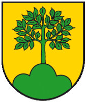 Ein gelbes Wappen mit einem grünem Baum auf einem gewellten grünen Hügel.